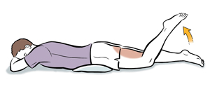Man lying prone with pillow under hips, bending one leg up at the knee.
